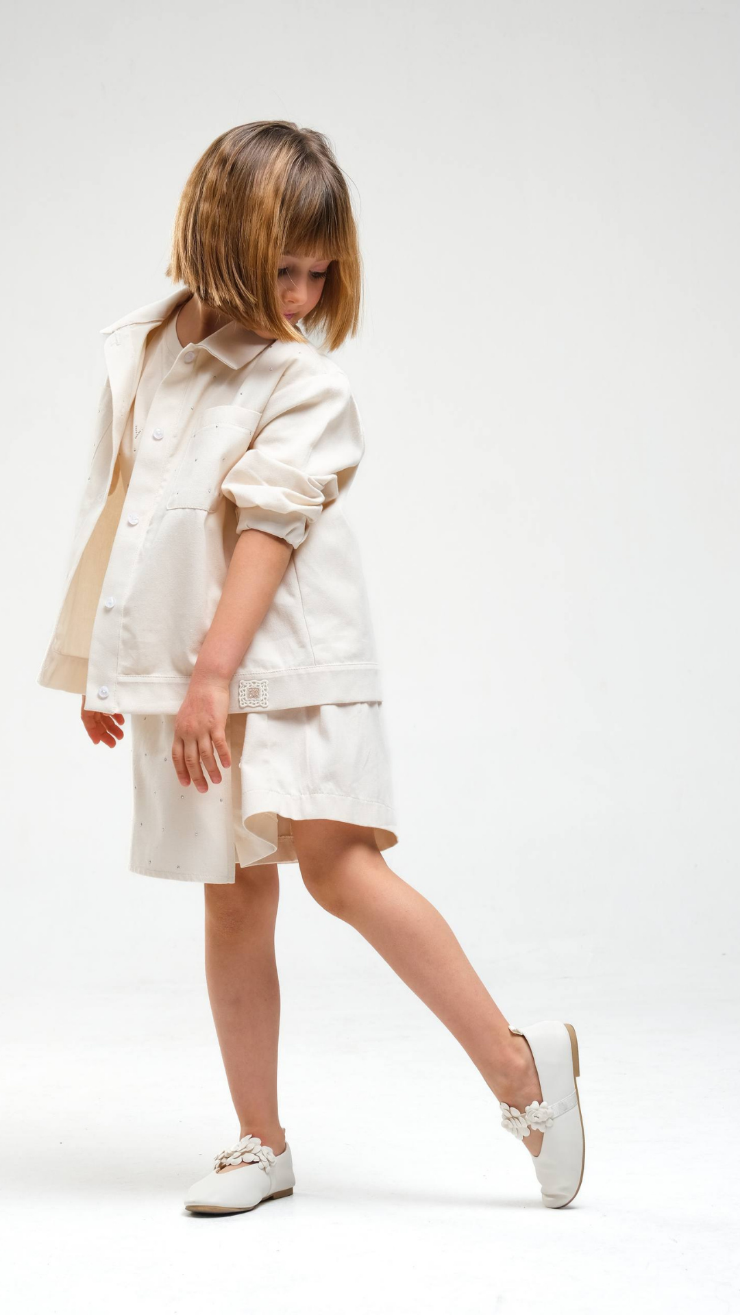 Ivory Breeze skirt set by NOV7 featuring a flowing skirt and matching top, styled with lightweight fabric and elegant design.