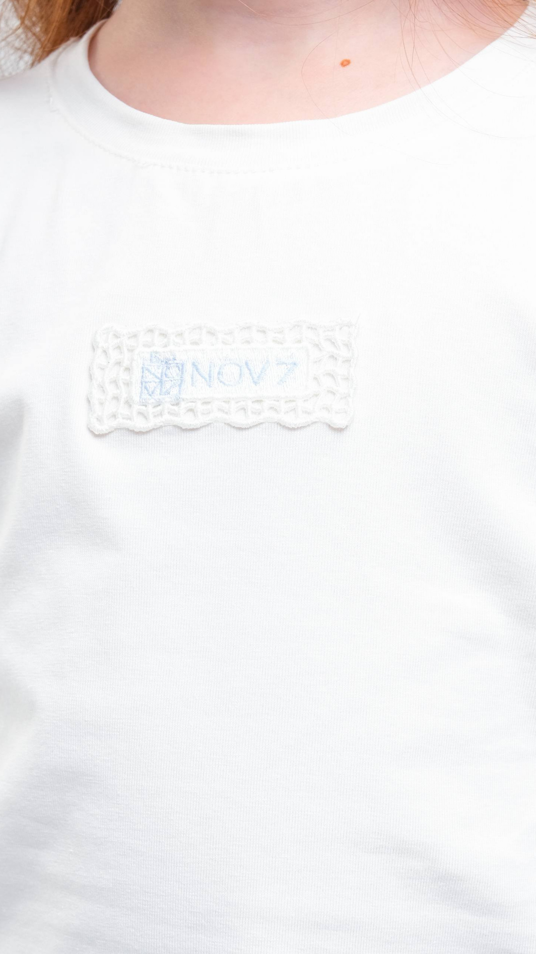 Soft navy NOV7 Signature Soft Tee t-shirt laid flat, showcasing its classic fit and smooth fabric for everyday casual wear.