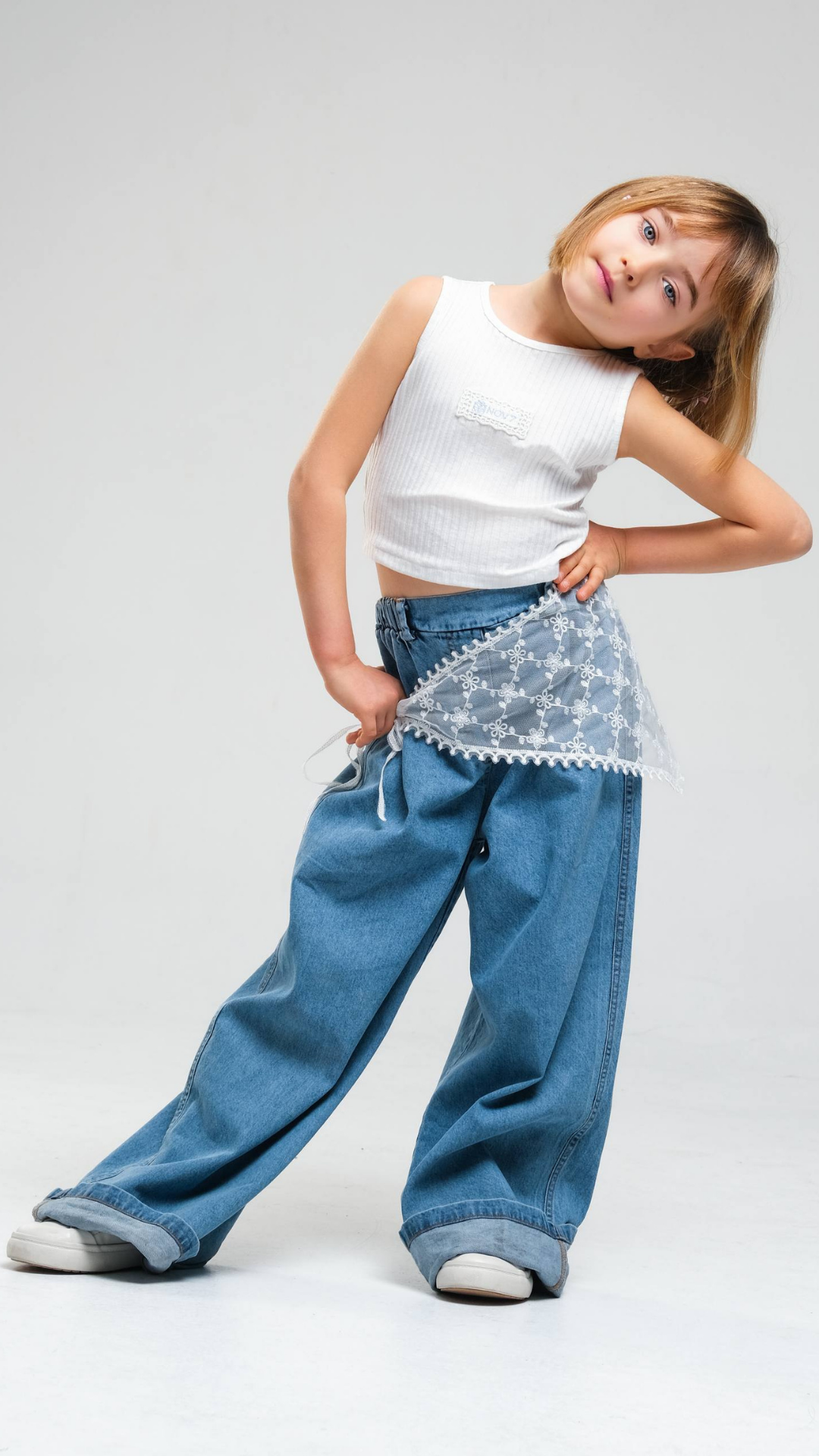 Wide-leg denim jeans with lace belt by NOV7, featuring a relaxed fit and stylish design, shown on a model.
