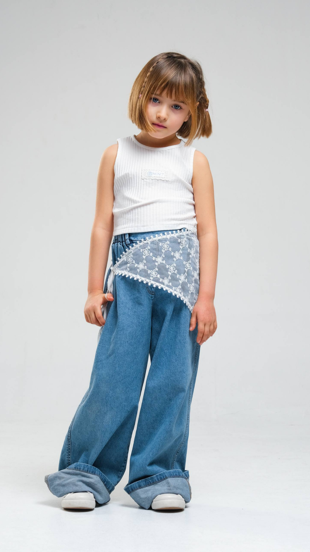 Wide-leg denim jeans by NOV7 featuring a stylish lace belt and classic five-pocket design.
