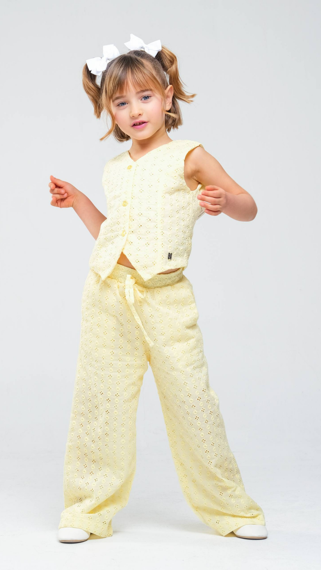 NOV7 Blossom Eyelet two-piece set featuring a floral-patterned top and matching skirt with eyelet detailing.