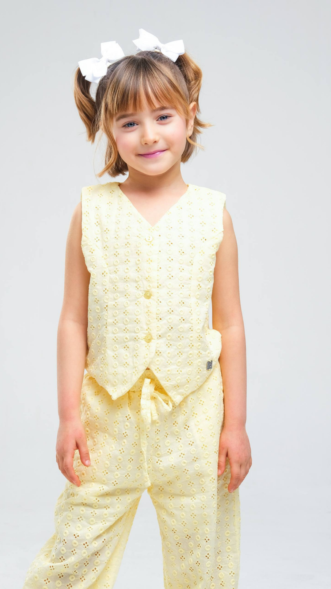 Light-colored Blossom Eyelet Two-Piece Set by NOV7 featuring eyelet details and a stylish, coordinated design for casual wear.