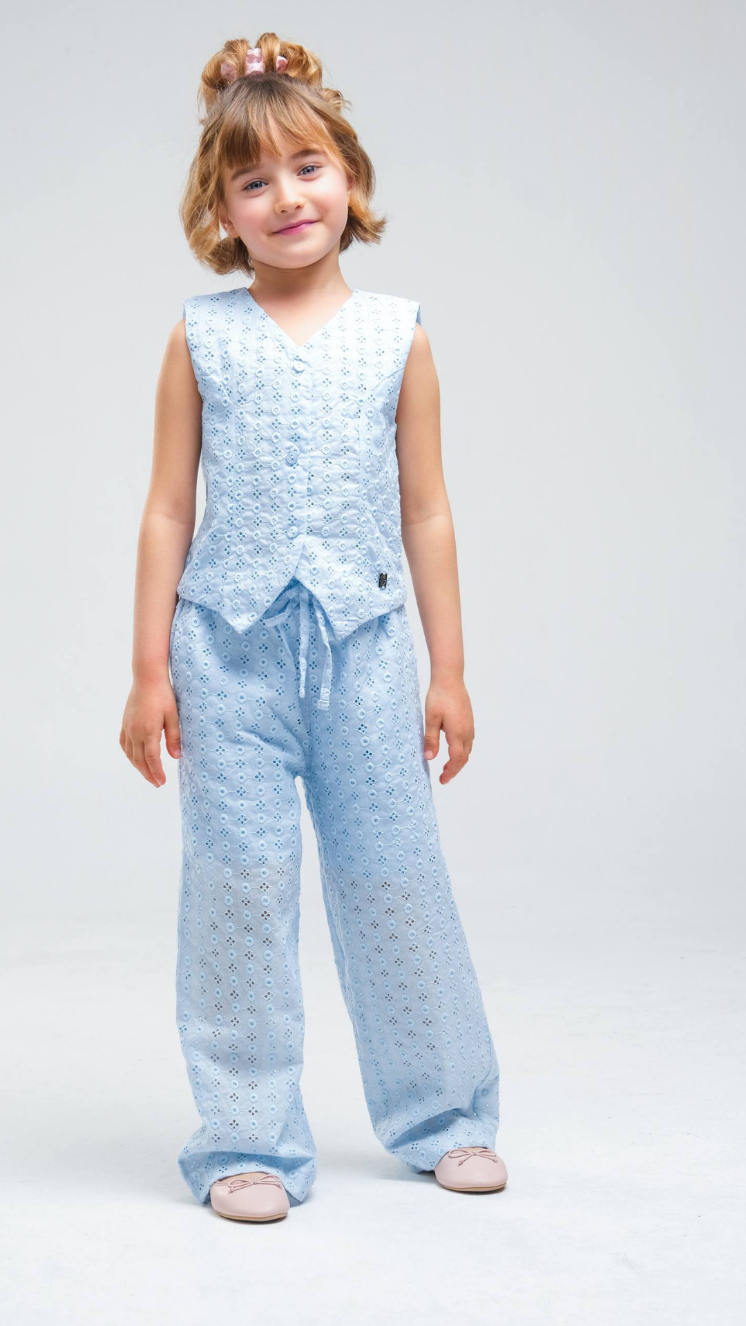 NOV7 Blossom Eyelet two-piece set featuring a floral-patterned top and matching skirt, perfect for stylish casual wear.