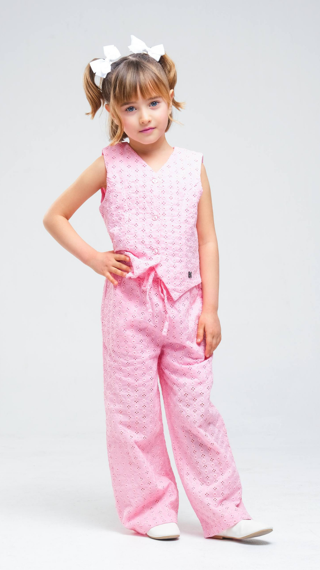 NOV7 Blossom Eyelet Two-Piece Set featuring a floral eyelet top and matching skirt on a model.