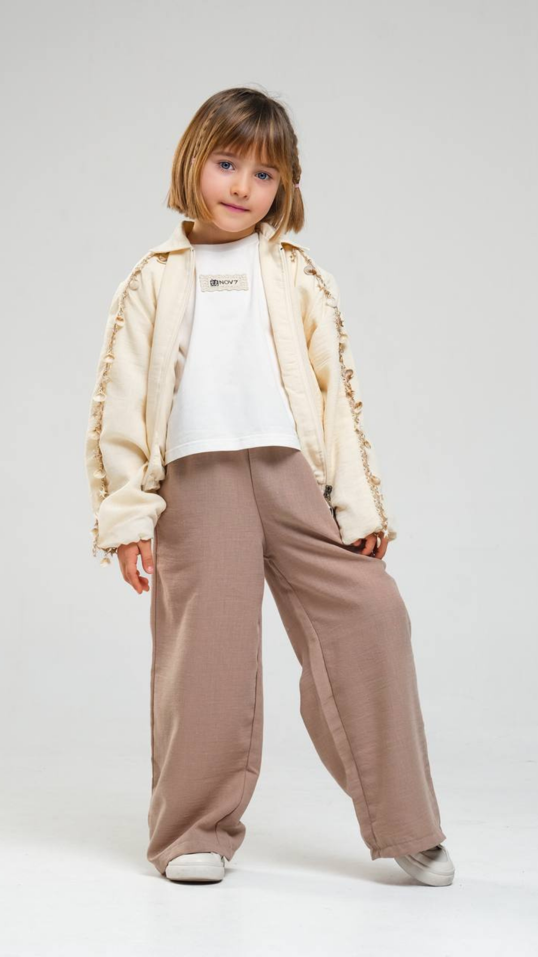 Ivory Breeze set by NOV7 featuring matching clothing pieces with soft, flowing fabric and elegant design.