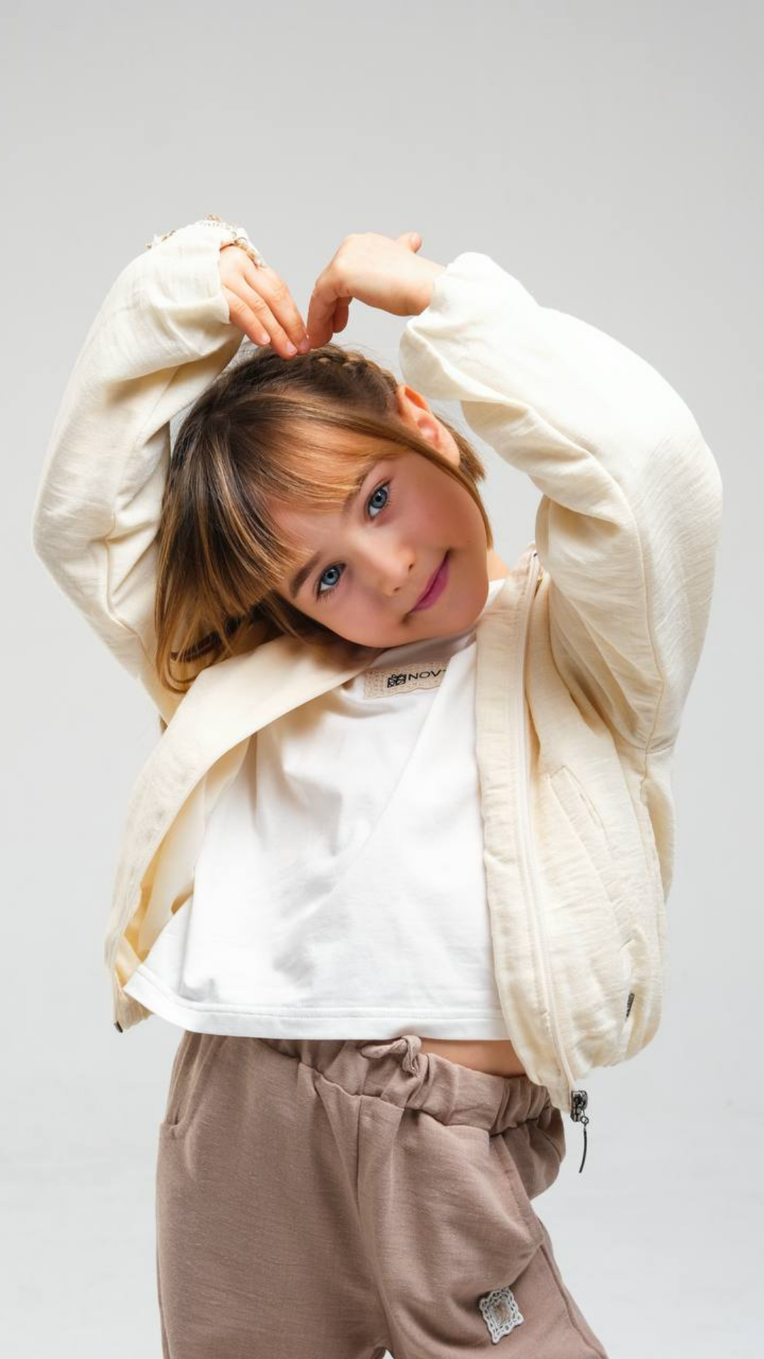 Ivory Breeze set by NOV7 featuring a coordinated collection of stylish clothing pieces in soft ivory fabric.