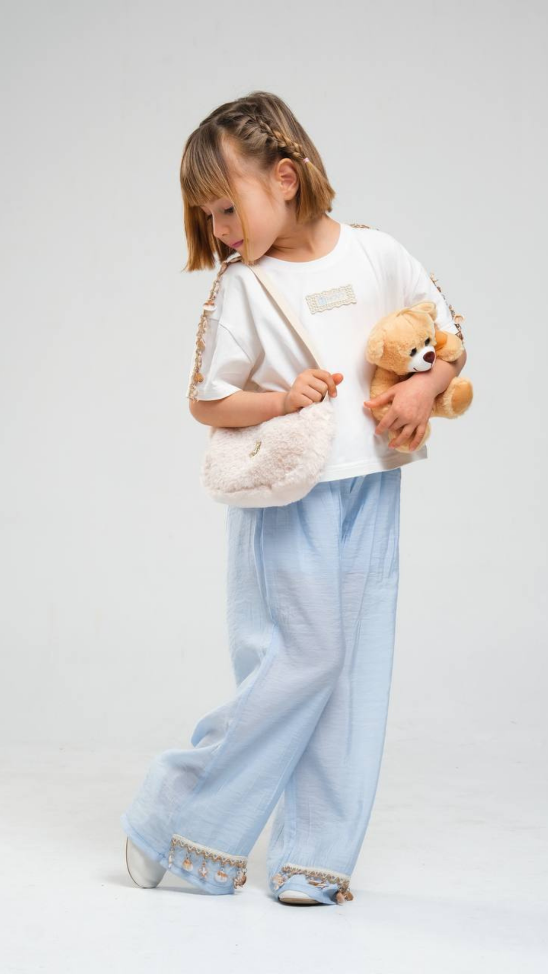 Coastal Breeze set by NOV7, featuring lightweight, ocean-inspired pieces with soft blue and sandy tones, perfect for summer wear.