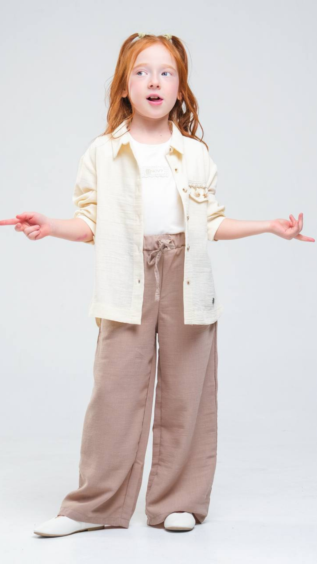 Seaside Charm 2-piece set by NOV7 featuring coastal-themed jewelry with shell and starfish designs on a white background