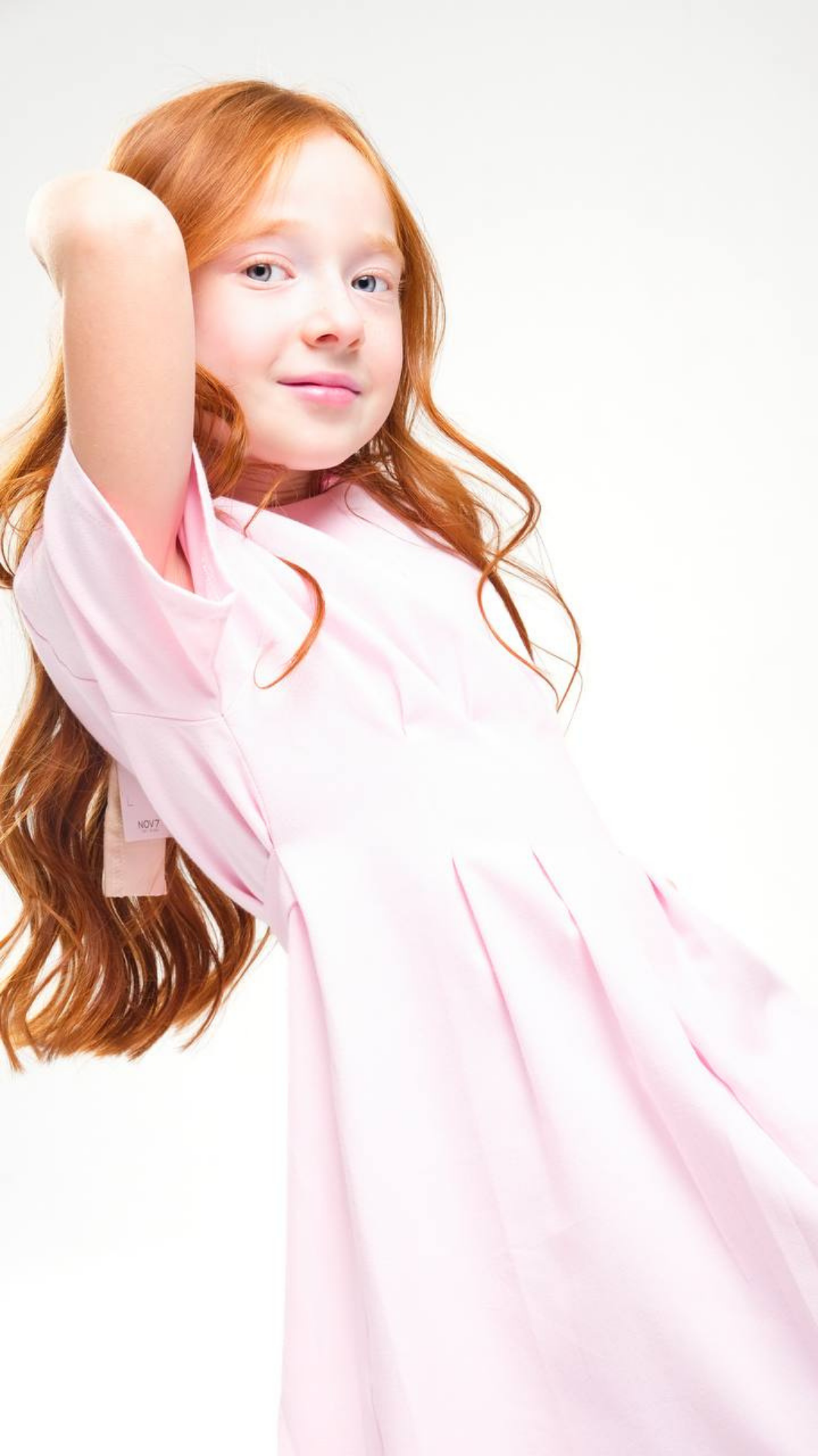 Soft Grace dress by NOV7, featuring a flowing fabric and elegant design, shown in a full-length view with detailed fabric texture.