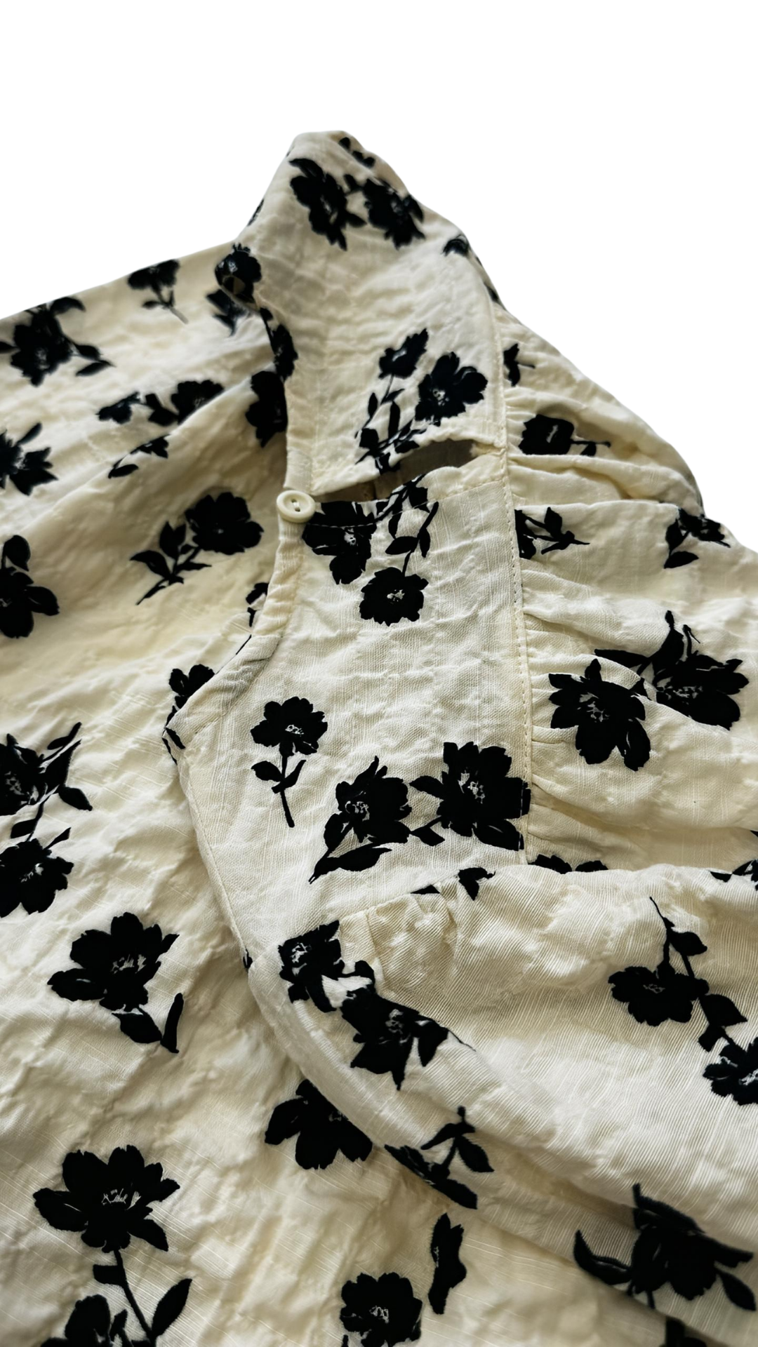 Milo Kidz Midnight Blossom dress featuring a dark floral pattern, sleeveless design, and a knee-length fit for girls.