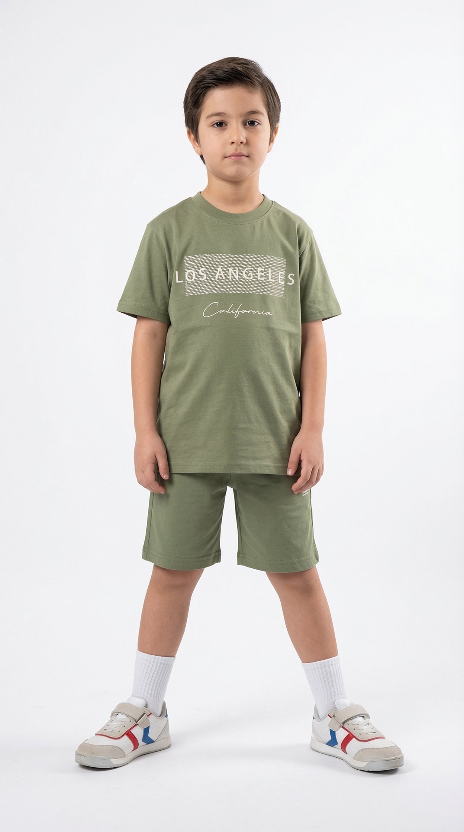Kocak Kids California Coast Set for children, featuring colorful casual outfits with a beach-inspired design in a studio setting.