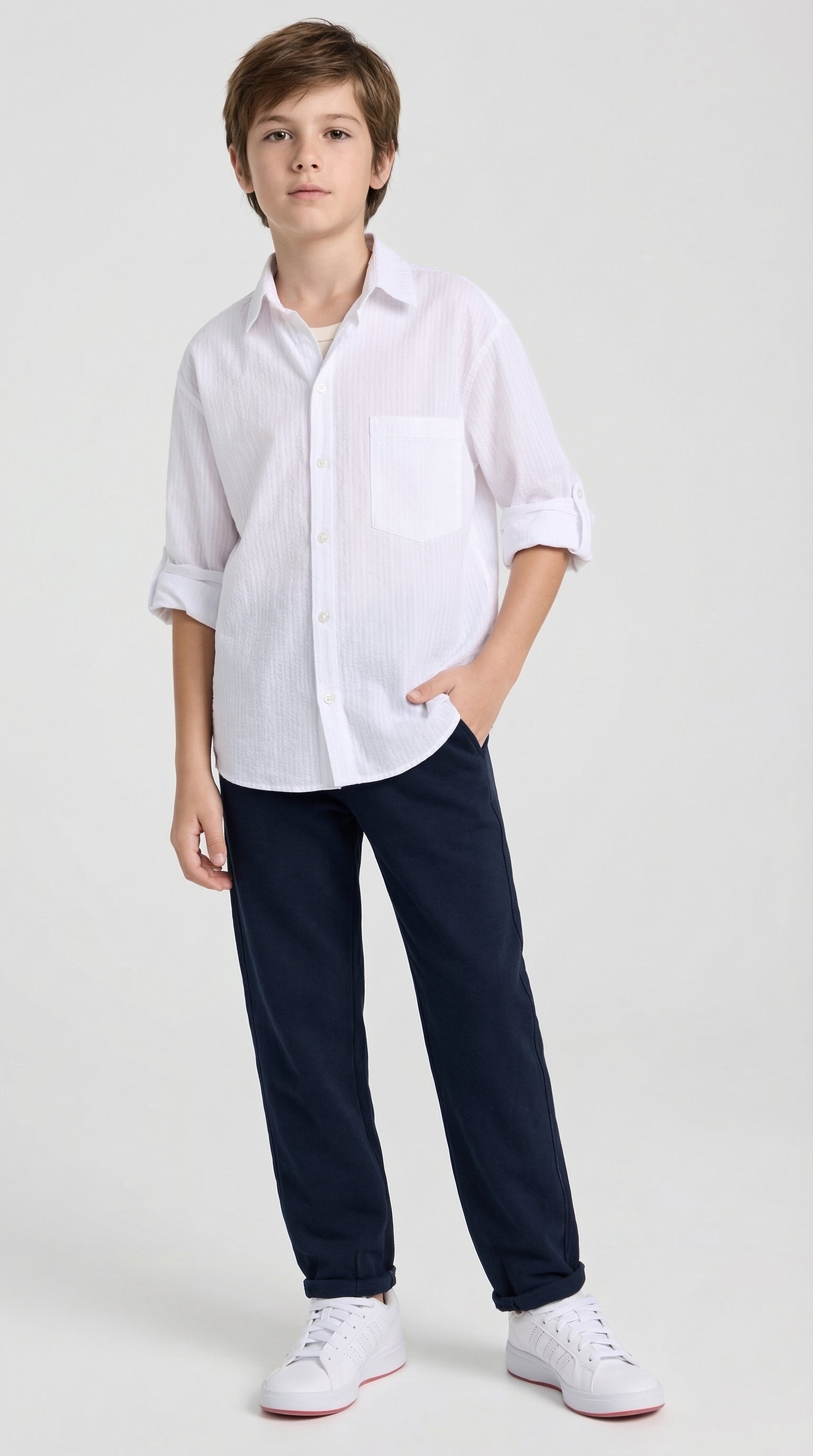 Children's classic white shirt and navy pants set by Escable Kids, featuring a stylish, well-fitted top with matching navy trousers.