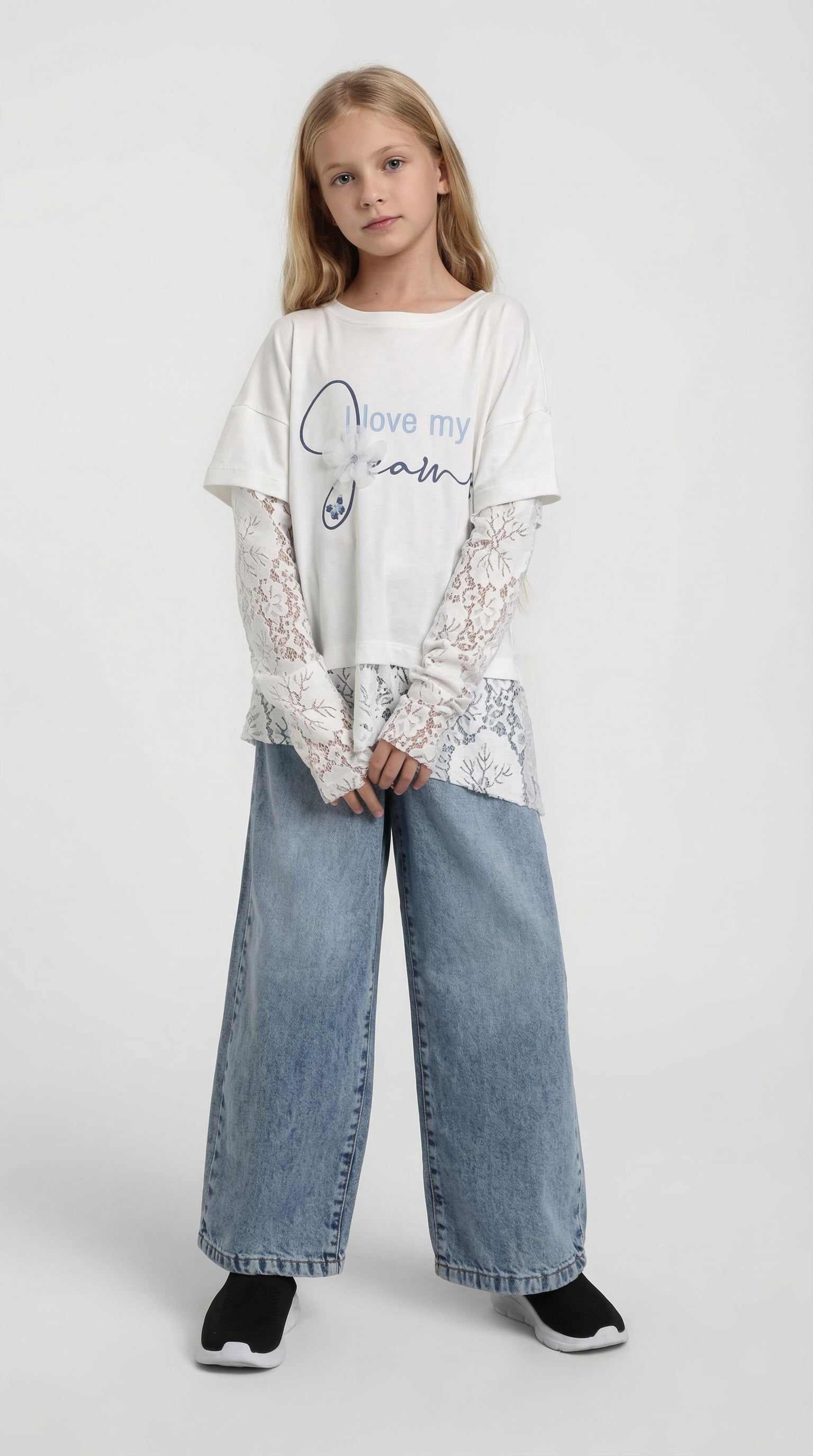 Child wearing a Dreams Lace Layer Tee by Escable Kids, showcasing the stylish lace detail and comfortable fit of the t-shirt.