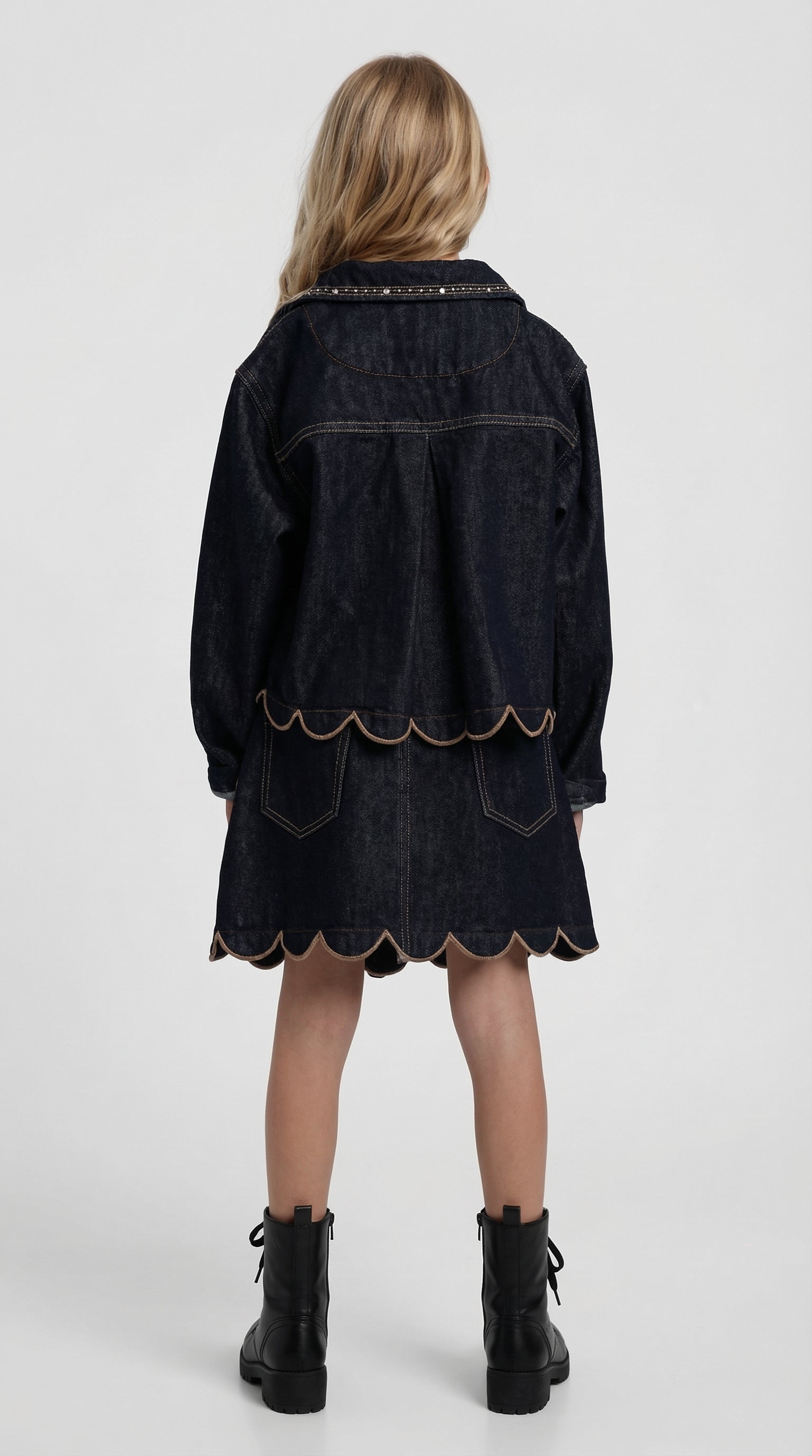 Children's scalloped denim jacket and skirt set by Escable Kids, featuring a coordinated denim outfit with scalloped edges.