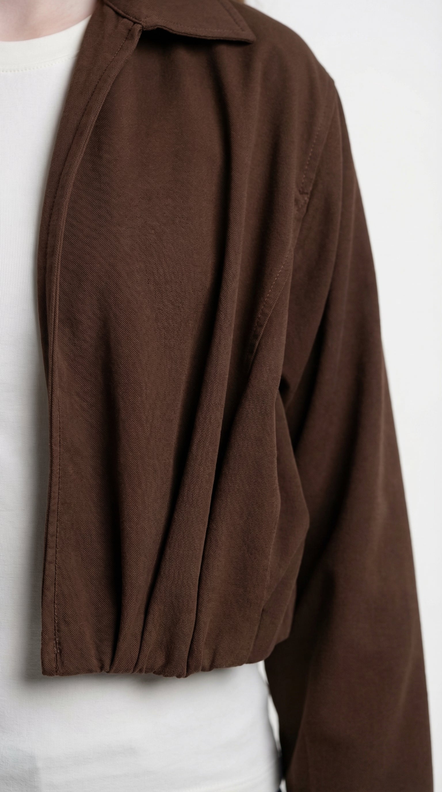 Children's chocolate-colored relaxed jacket by Escable Kids, featuring a comfortable fit and stylish design for casual wear.