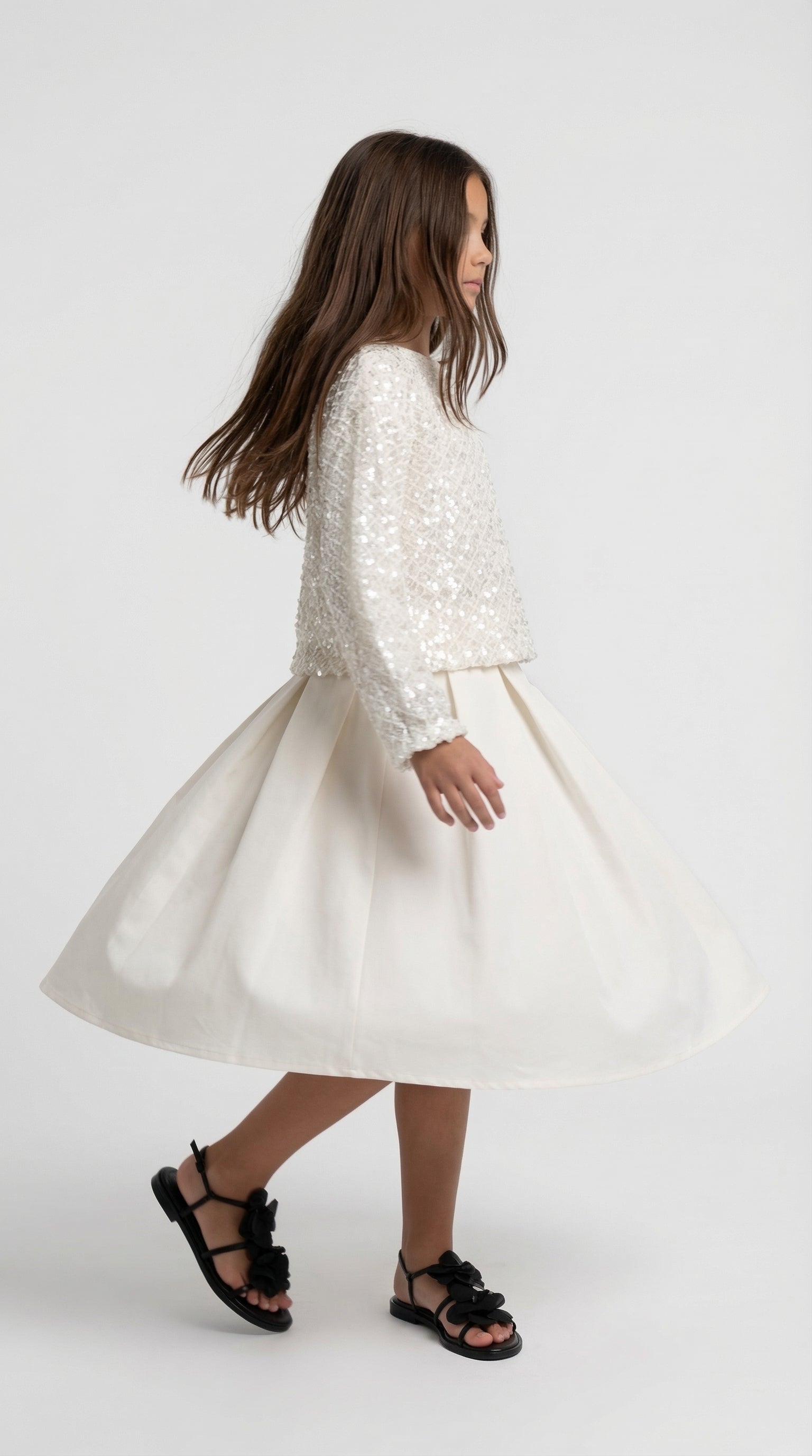 Ivory sparkle dress set for kids by Escable Kids, featuring a shimmering fabric and elegant design suitable for special occasions.