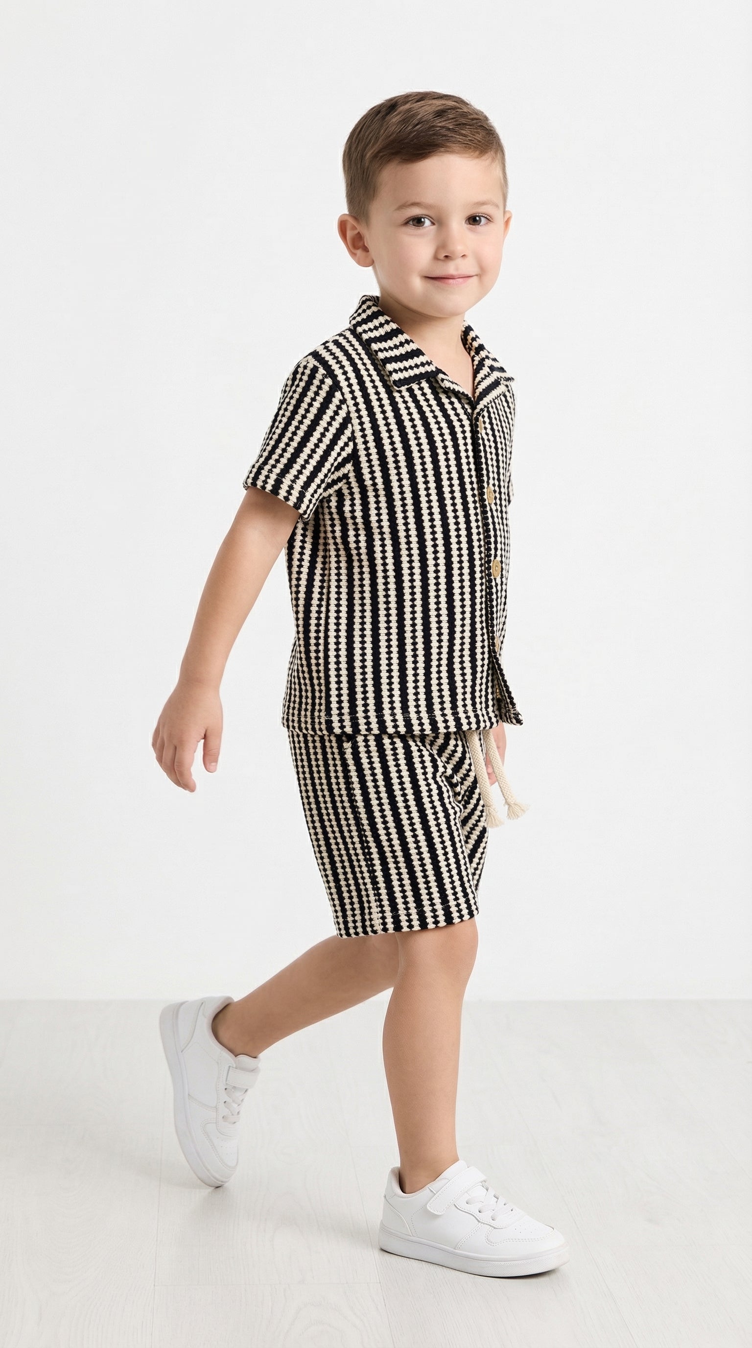 Children's summer set by Bobby Jr Kids Wear featuring a mono stripe design, including a top and shorts, perfect for warm weather.