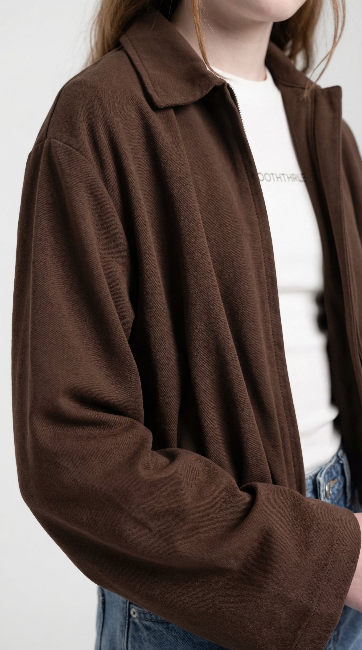 Children's chocolate brown relaxed jacket from Escable Kids, shown with a cozy, casual fit and soft fabric details.