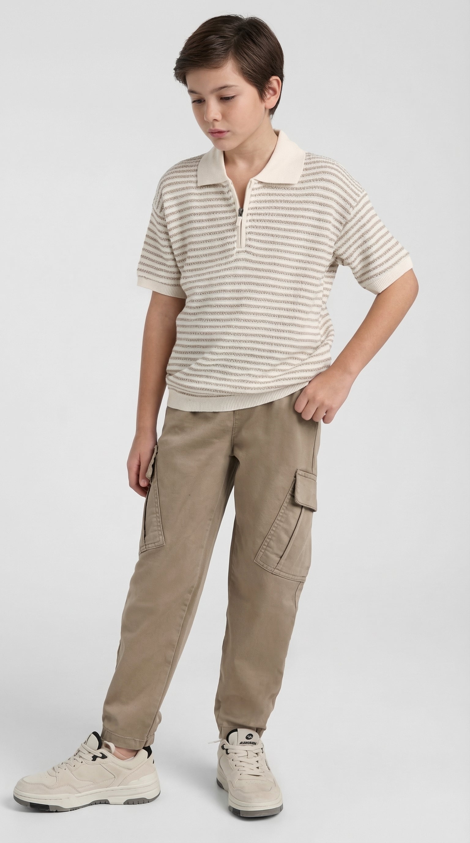 Children's beige knit polo and sand cargo set from Escable Kids, featuring a cozy knit polo top and casual cargo pants.