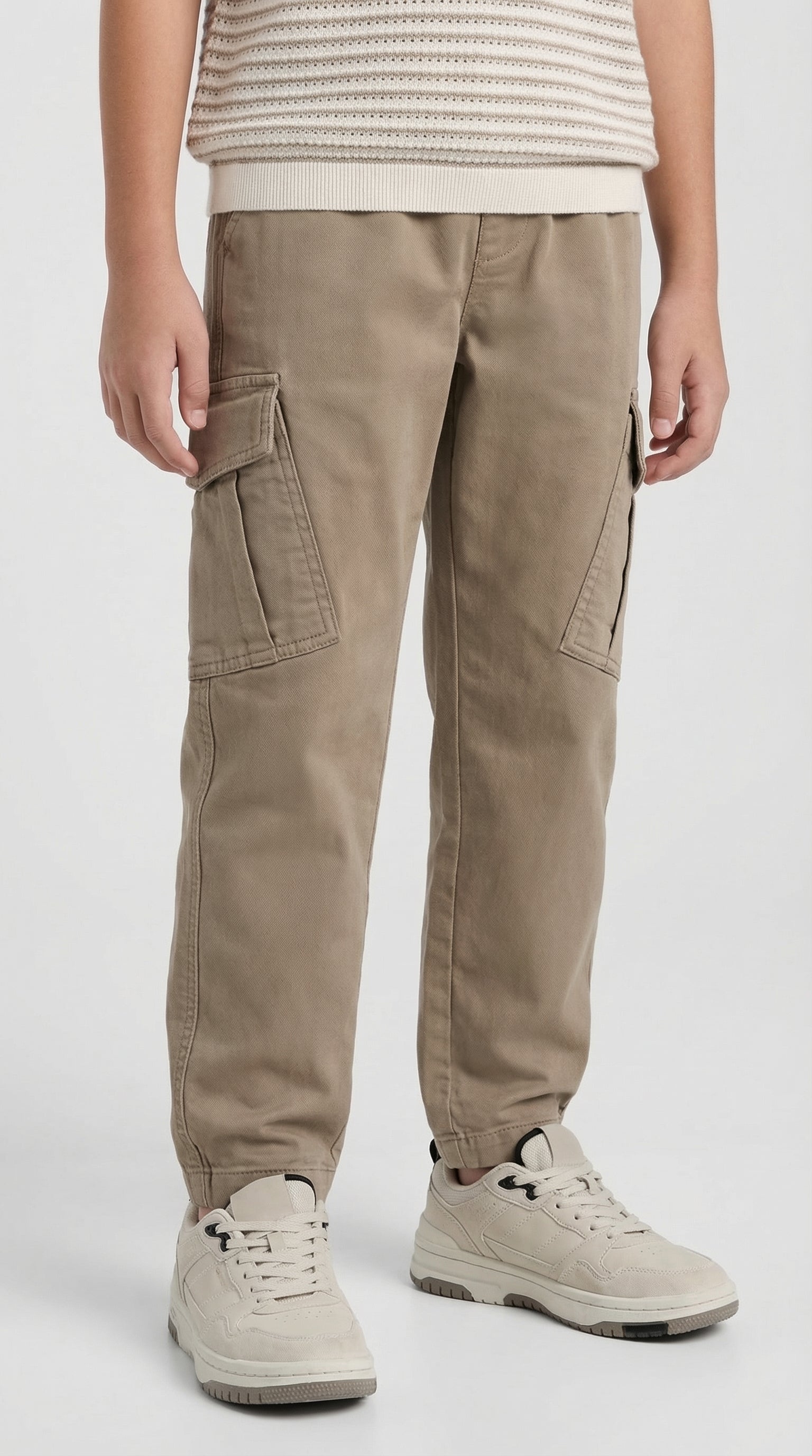 Children's sand cargo pants by Escable Kids, featuring multiple pockets and a comfortable fit, shown on a child.