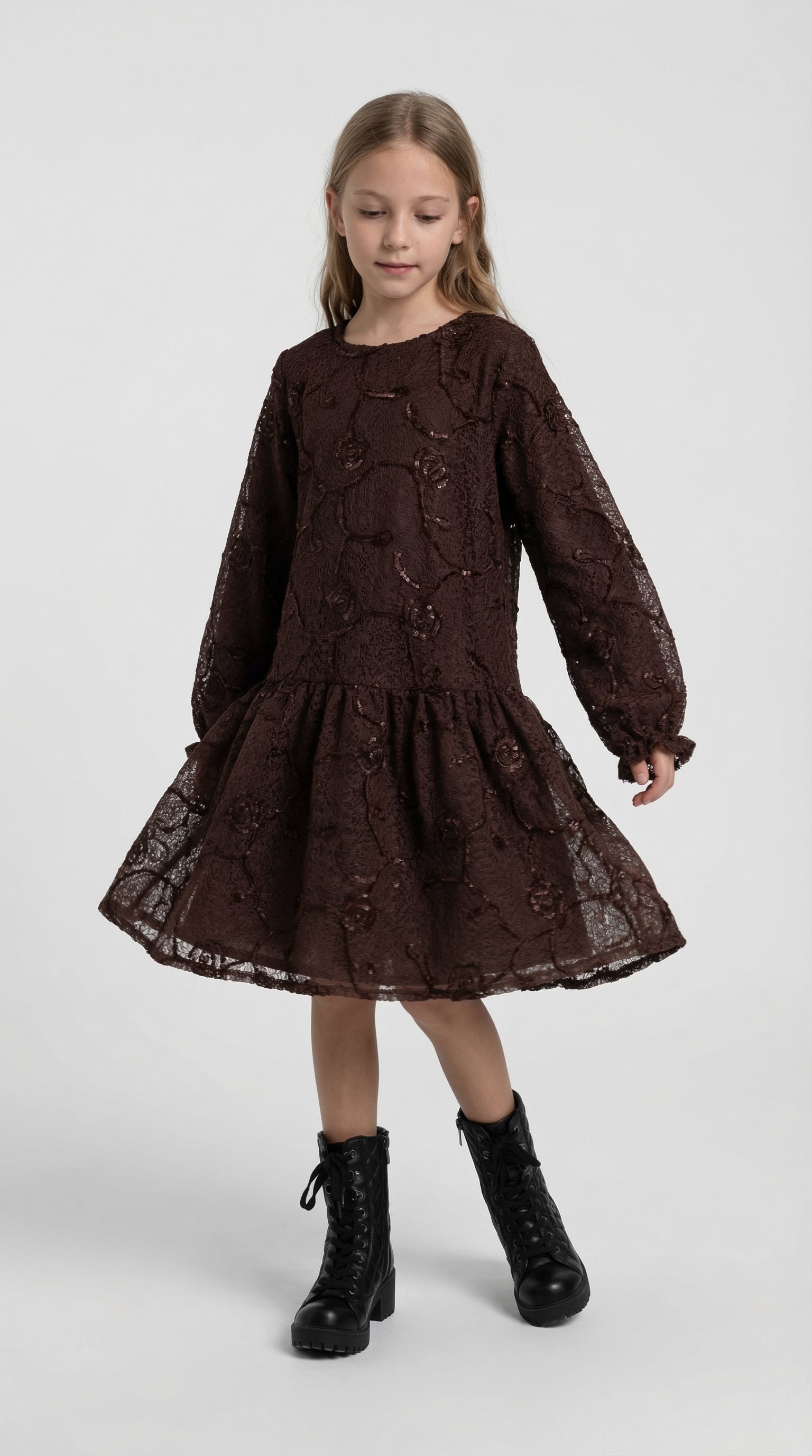 Children's Bloom Lace Dress by Escable Kids, showcasing a delicate lace dress with floral details on a young girl.