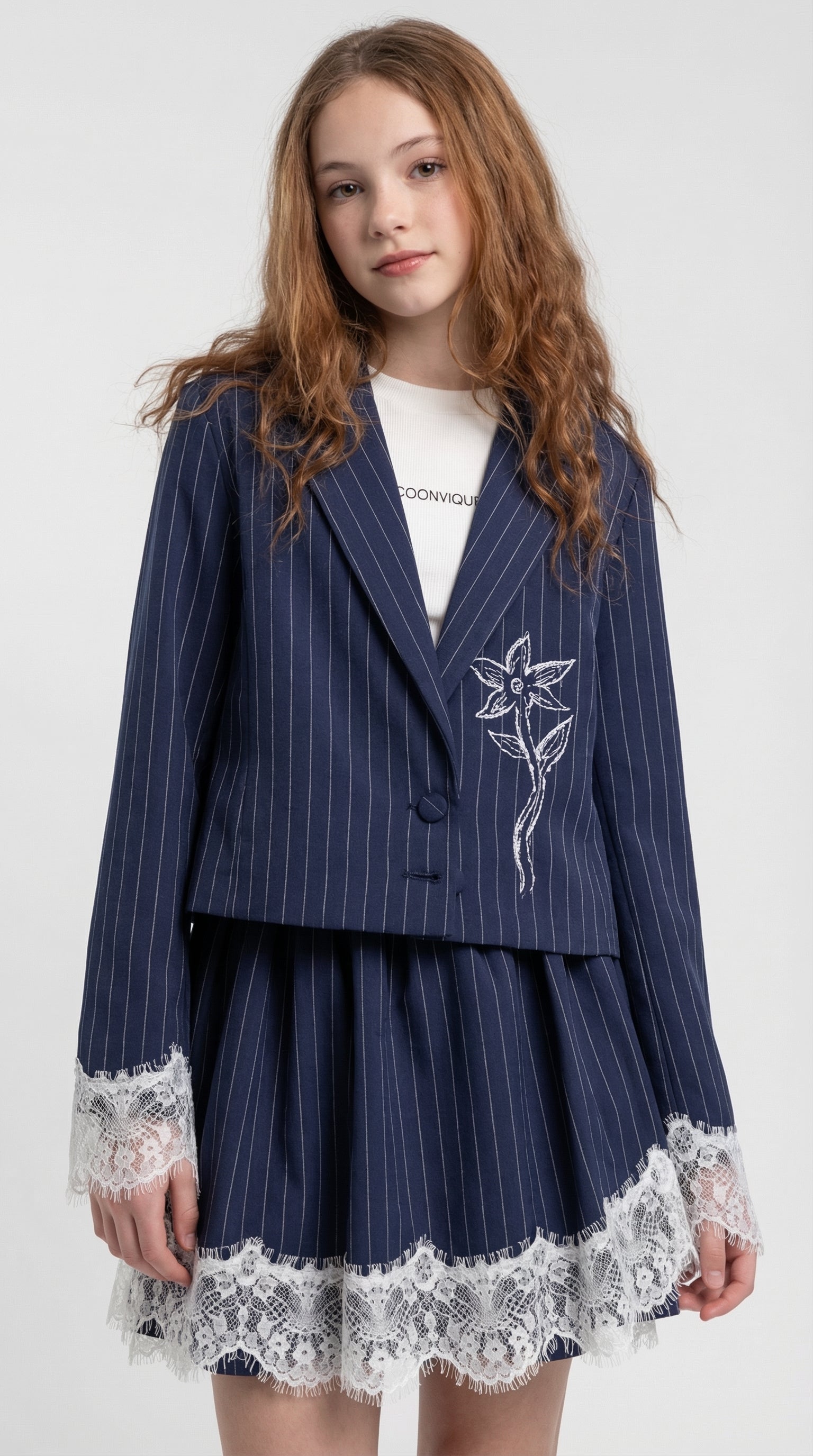 Children's navy pinstripe lace trim set by Escable Kids, featuring a coordinated top and bottom with delicate lace details.