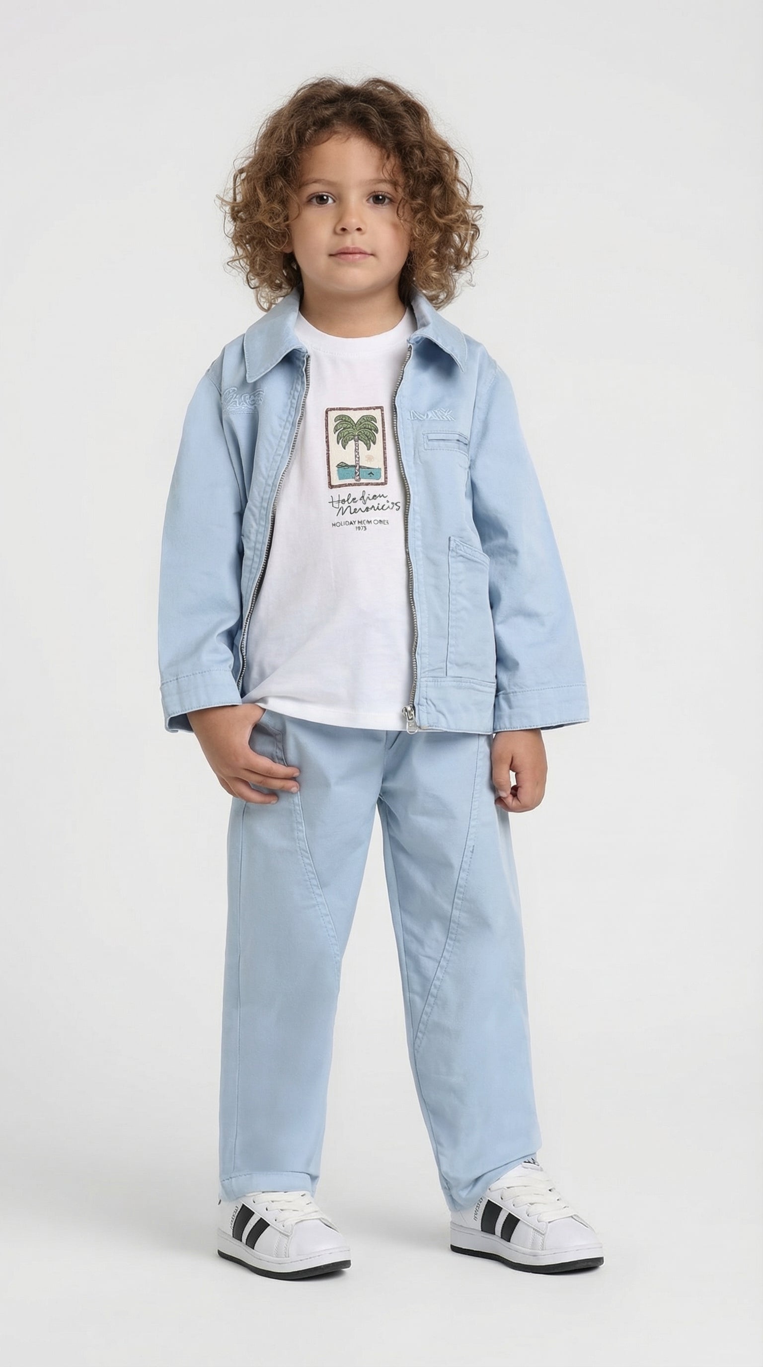 Escable Kids Sky Explorer three-piece set featuring a colorful top, shorts, and matching accessories for children.