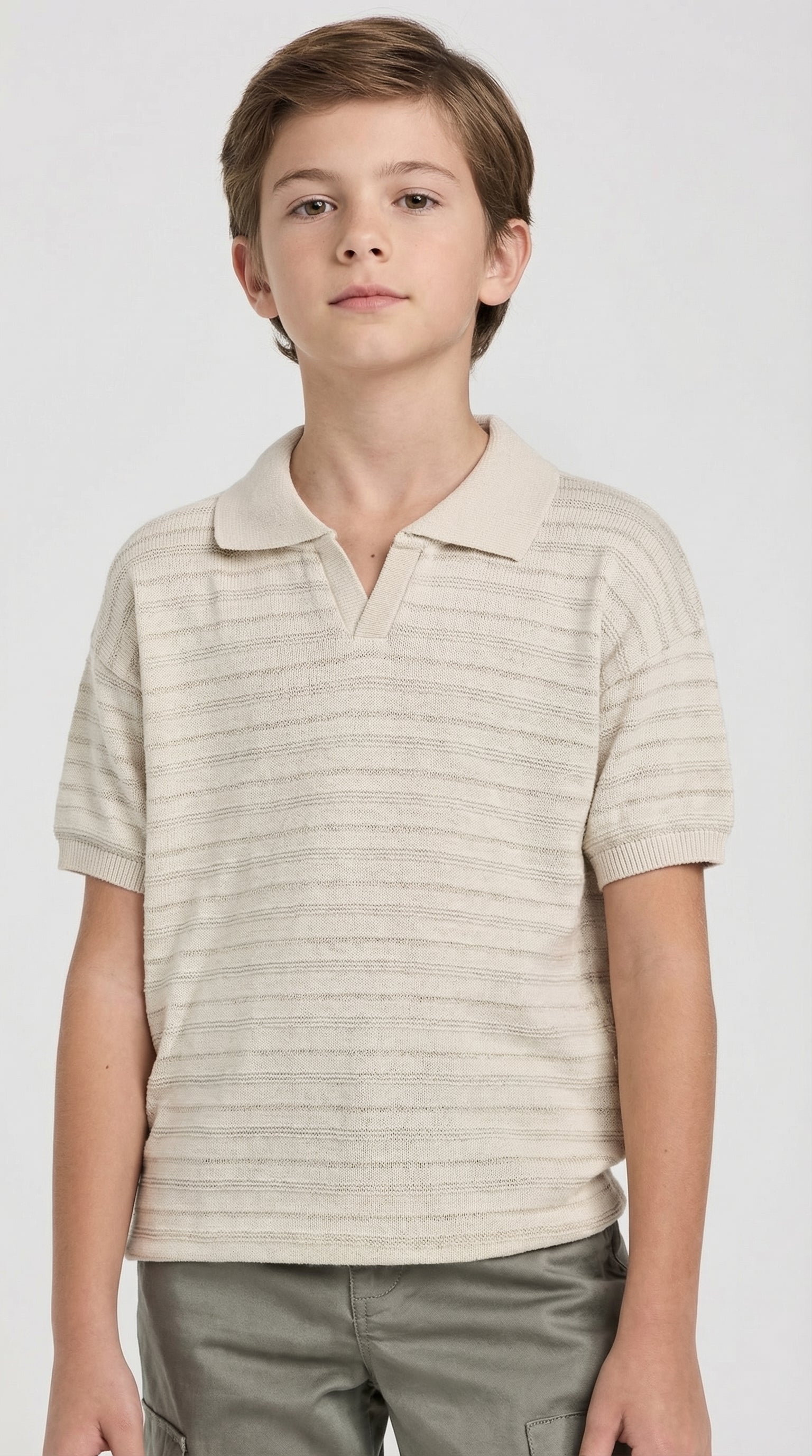 Children's classic knit polo shirt by Escable Kids featuring a collared design and soft, textured fabric in a casual style.