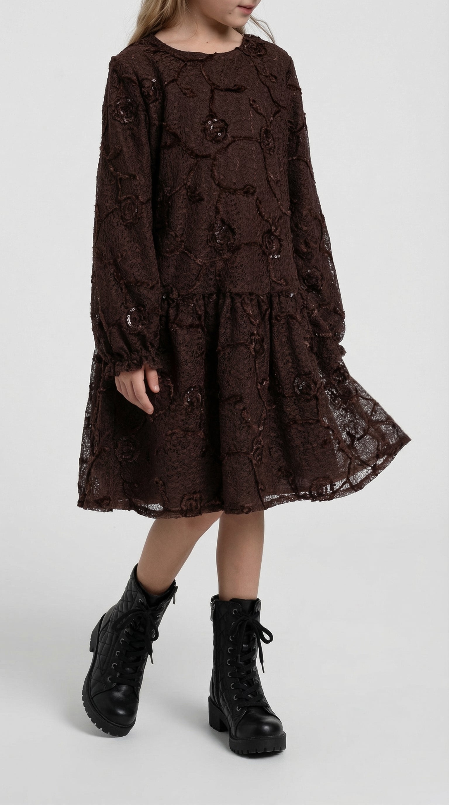 Child wearing a white Bloom Lace Dress by Escable Kids, featuring delicate lace details and a cute, elegant style.