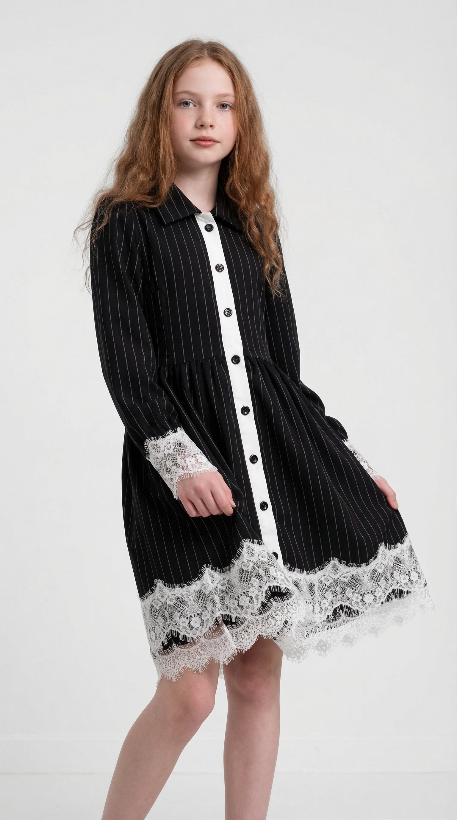 Children's Midnight Pinstripe Lace Dress by Escable Kids, featuring lace details and a classic pinstripe pattern.