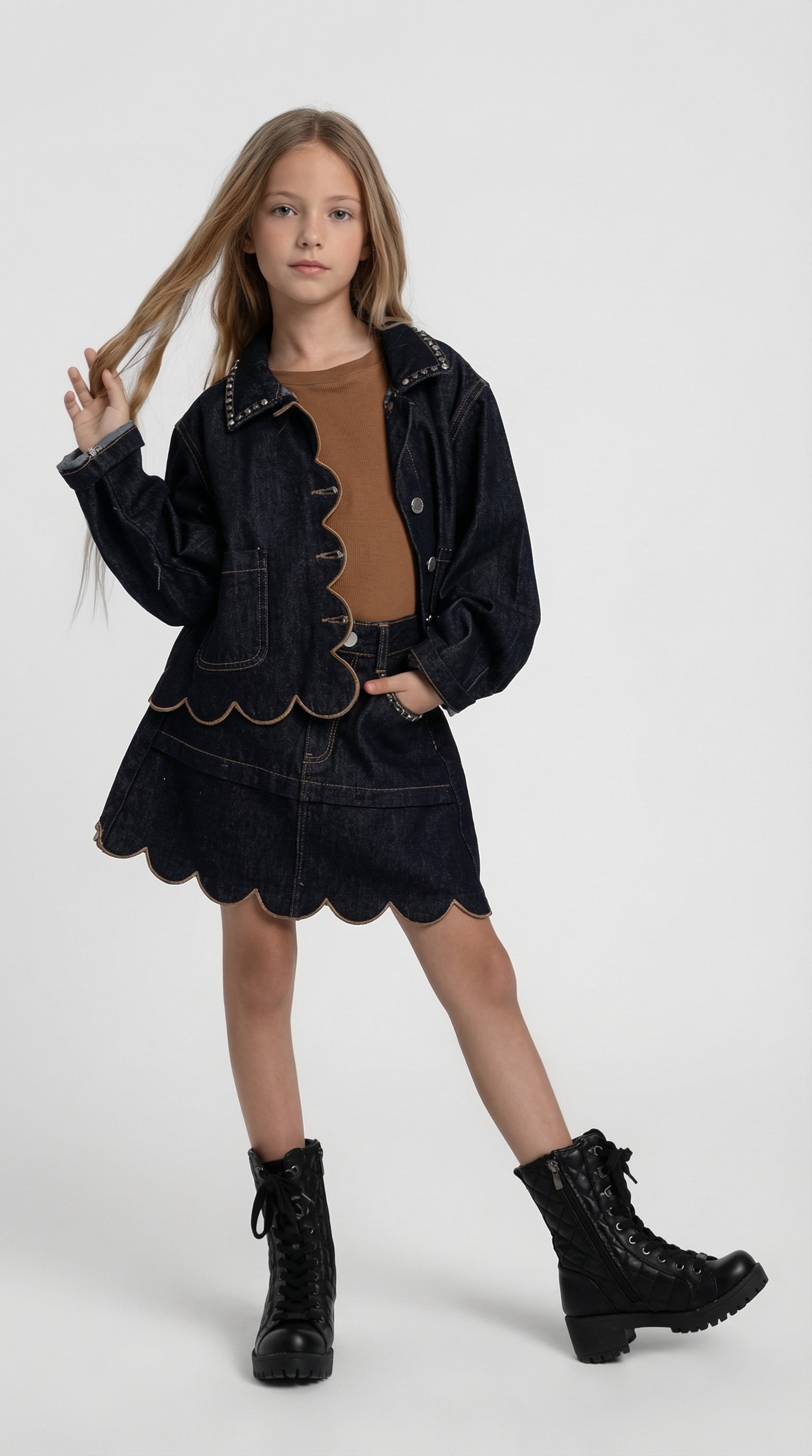 Children's scalloped denim jacket and skirt set by Escable Kids, featuring a coordinated denim outfit with scalloped details.