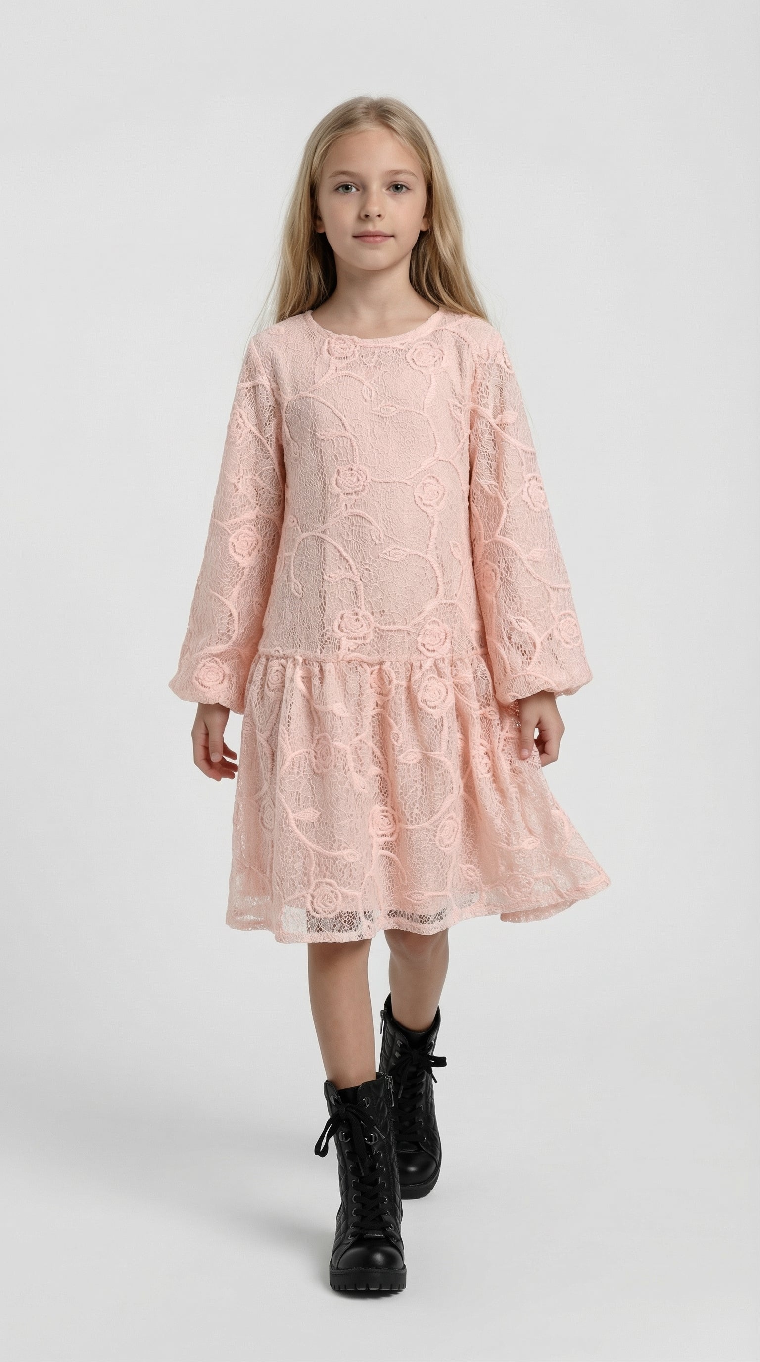 Child wearing a white Bloom Lace Dress by Escable Kids, featuring delicate lace details and a flowy design.